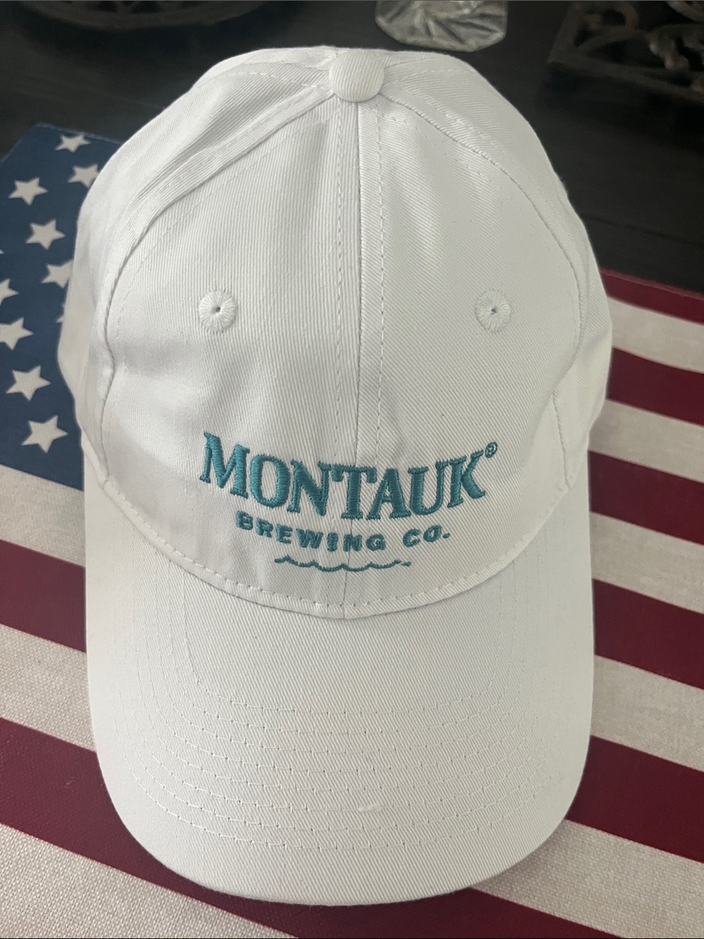 Port and Company White Baseball Cap with Teal Montauk Brewing Logo